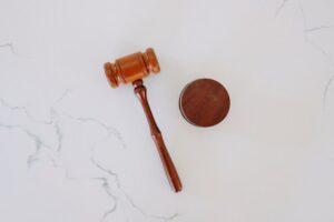 A gavel laying on marble.